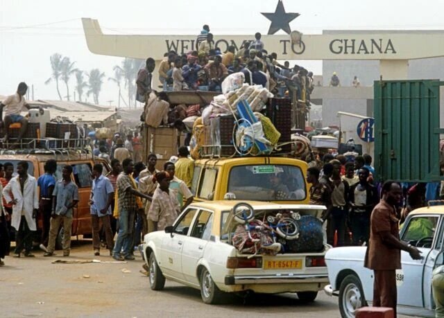 Ghana must go immigration car with bags stacked on top by a shipping port